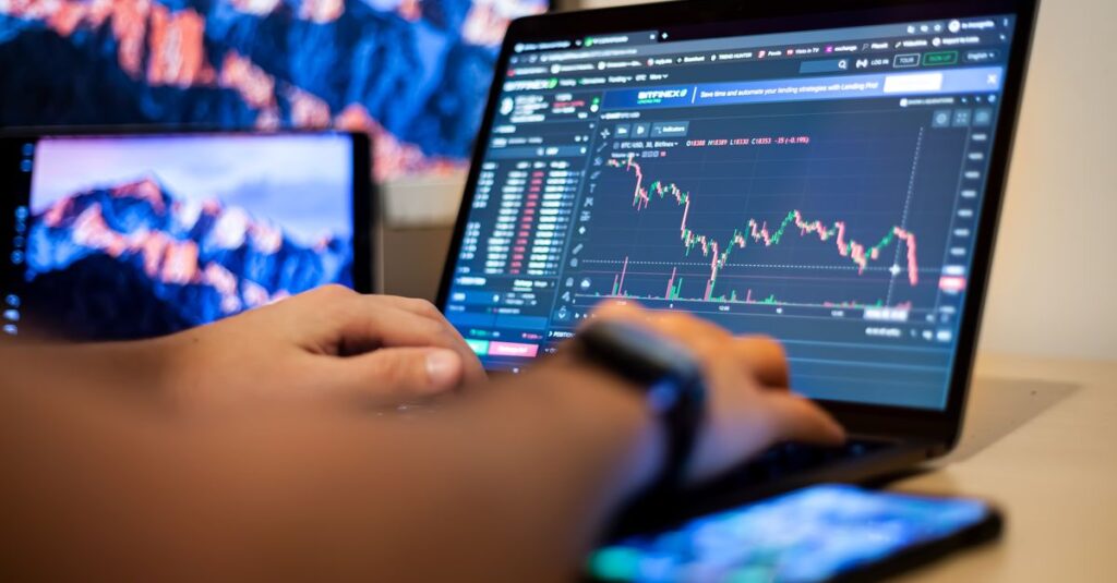 Trader comparing forex indicator combinations on a laptop with price charts