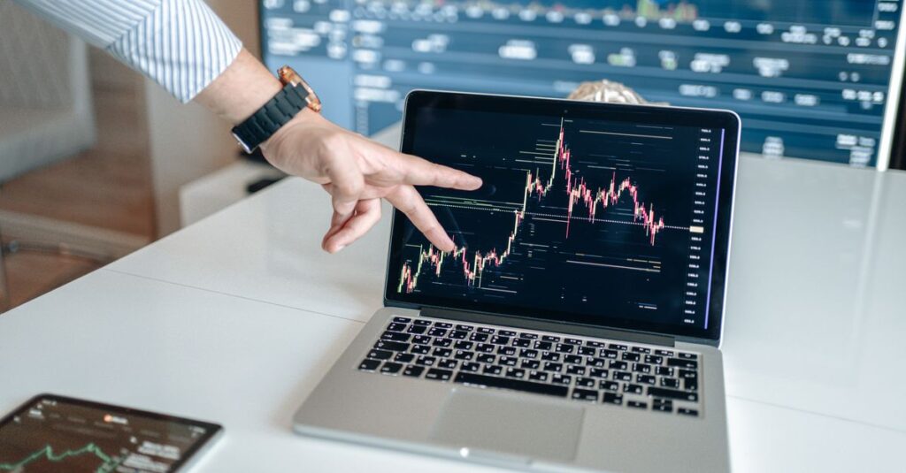 Forex price chart on a laptop with technical indicators overlaid, illustrating forex indicators explained