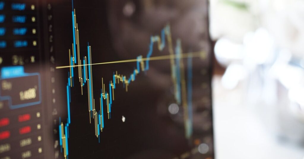 MT5 Forex indicators displayed on a candlestick trading chart across a monitor screen