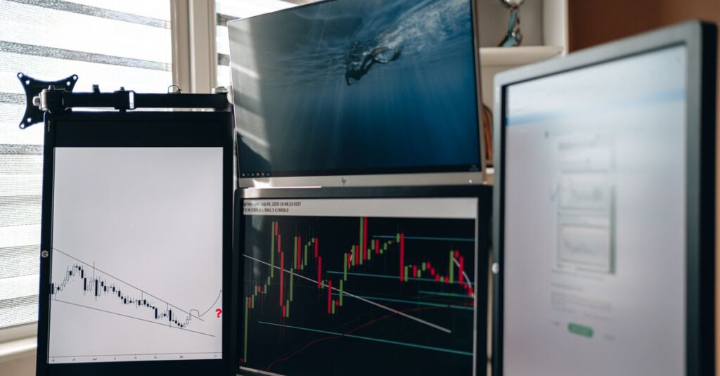Fast lower-timeframe forex scalping chart with indicators on a monitor